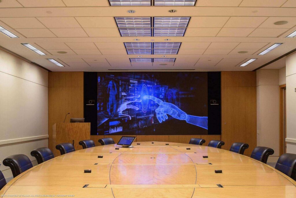 A sophisticated boardroom with elegant furnishings and state-of-the-art technology at IBM Headquarters.