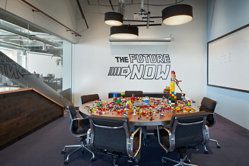 A vibrant conference room adorned with colorful Lego-themed decor and modern furniture.