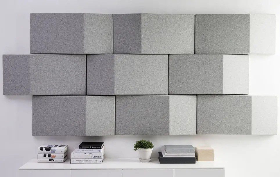 Wall-mounted acoustic panels installed in a conference room to enhance sound quality and reduce echo.