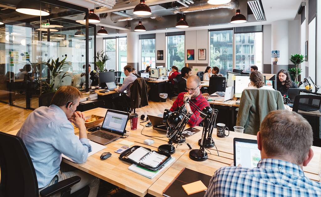 Interior view of a WeWork office in New York City, featuring modern workstations and collaborative spaces.