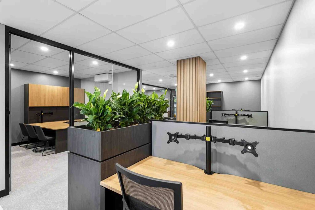 A modern office layout by Prima Commercial Fitouts, showcasing an efficient and functional commercial space with well-organised workstations and meeting areas for optimal workflow.