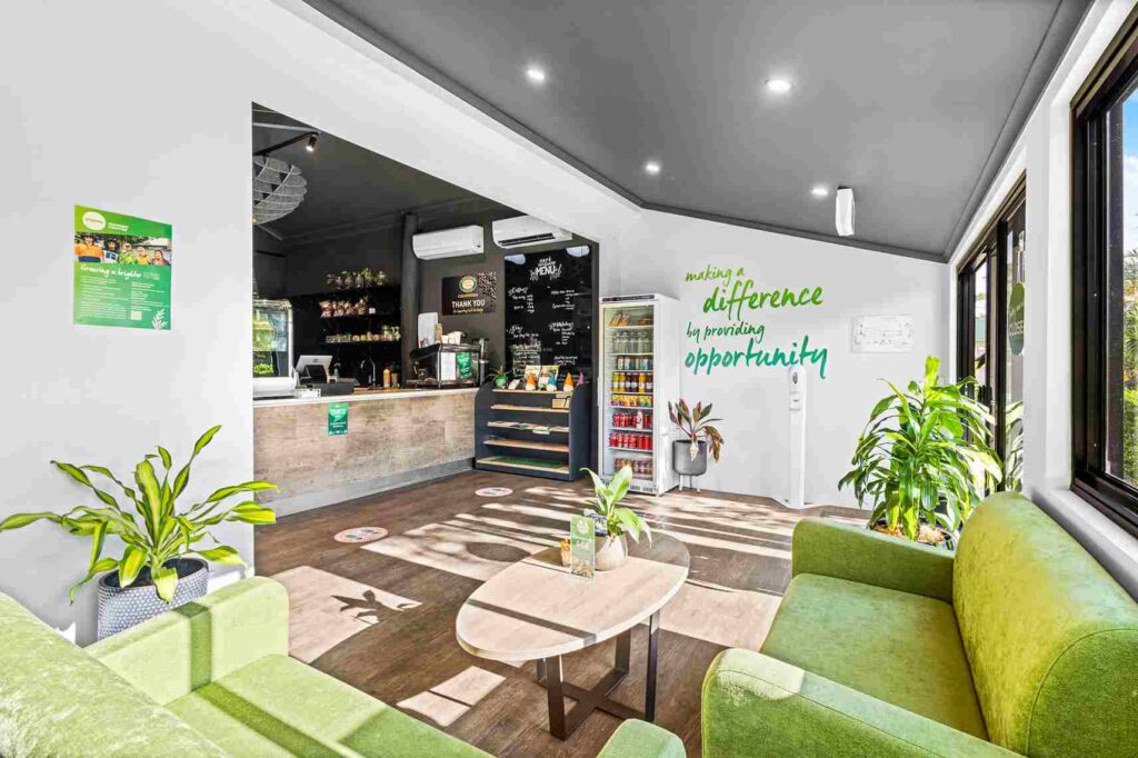 Cafe on George featuring biophilic design elements by Prima Commercial Fitouts, including greenery and natural textures