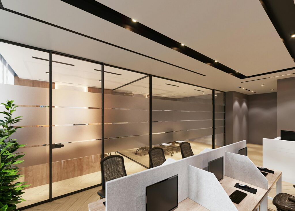 A high-end modern office interior featuring ergonomic workstations with privacy screens and sleek glass-partitioned meeting rooms, representing excellence in smart office space design.